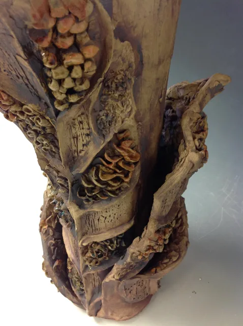 Close detail of a layered organic sculpture with rounded forms inside.