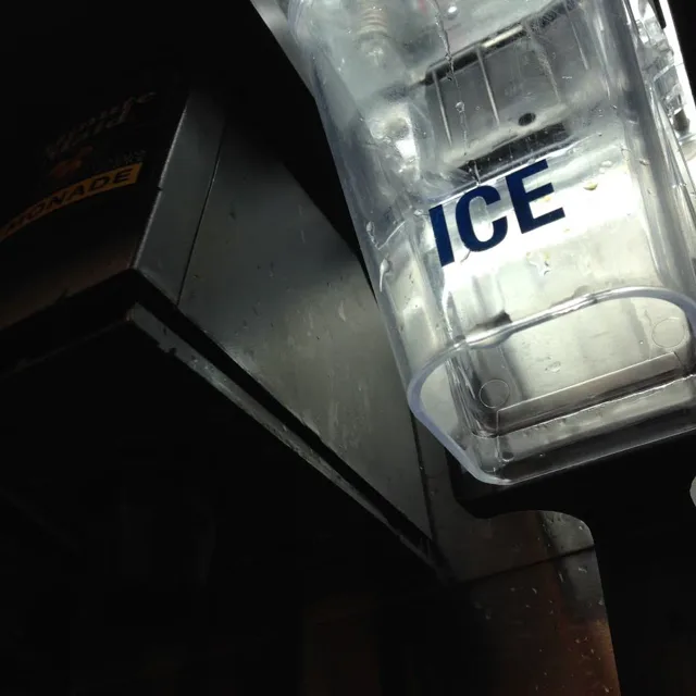 An ice dispenser viewed from below at an angle.