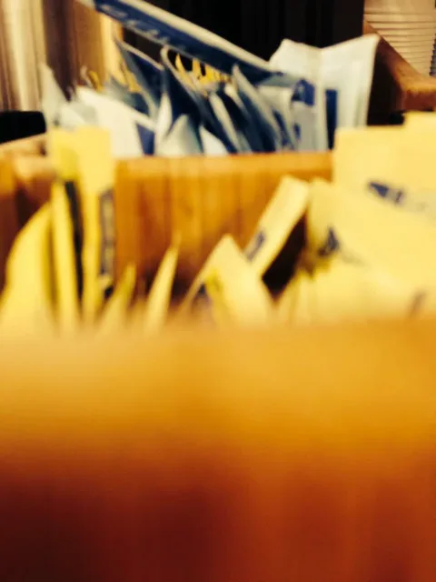 Packets standing upright in a counter organizer.